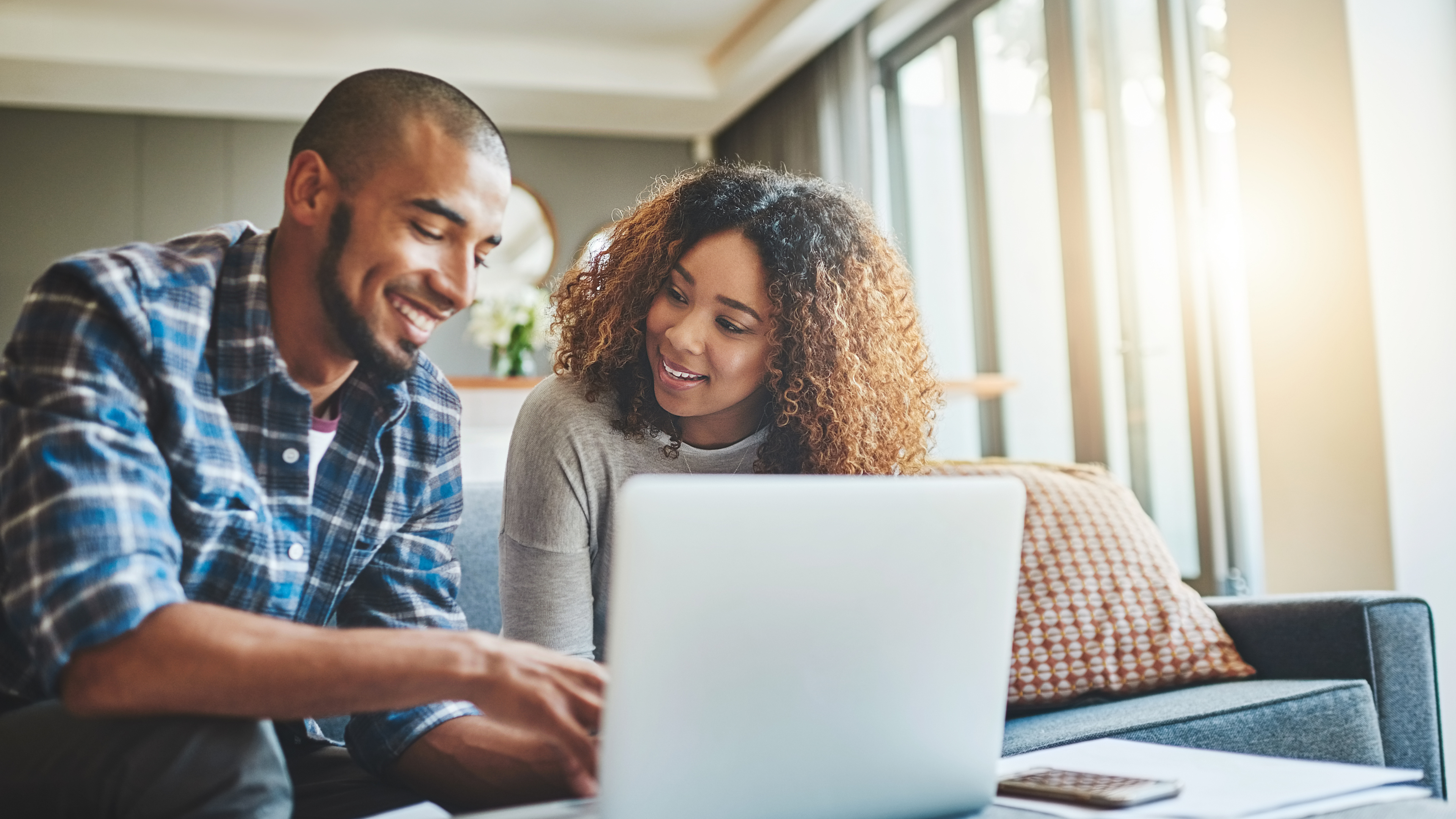 Man and Lady working on Laptop